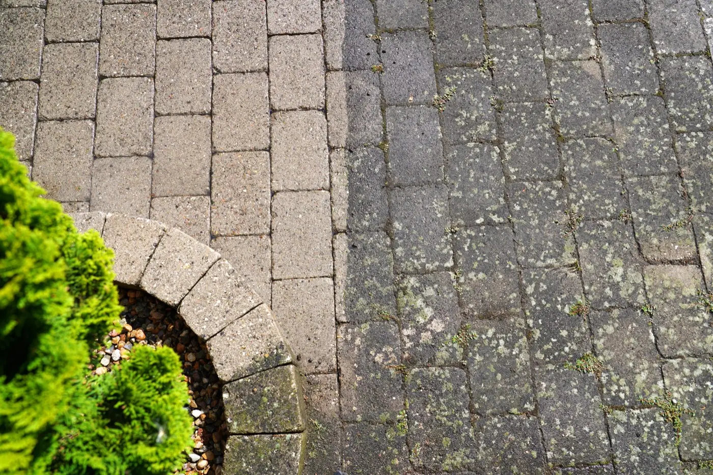 Block paving cleaned on one side only, showing the difference a single pass makes