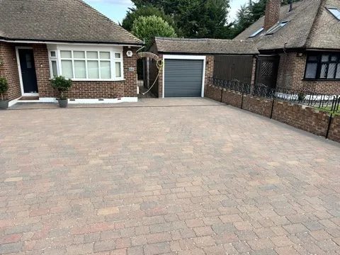 Driveway and garage area after professional cleaning