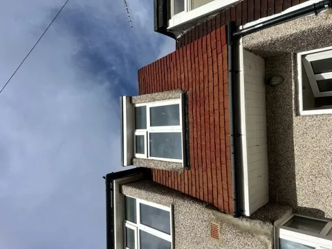 Roofline with gutter and downpipe on a Kent home